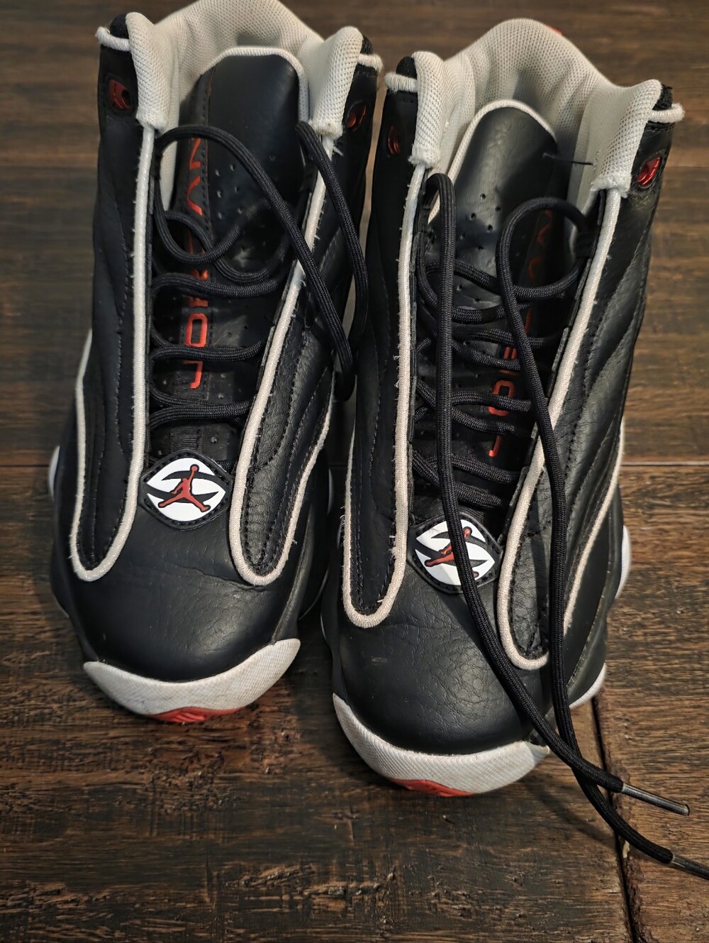 Nike Black and White High-Top Basketball Sneakers with Red Accents